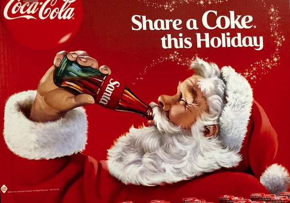 Coca Cola Santa drinking a personalised Coke bottle showing the power of branding at Christmas